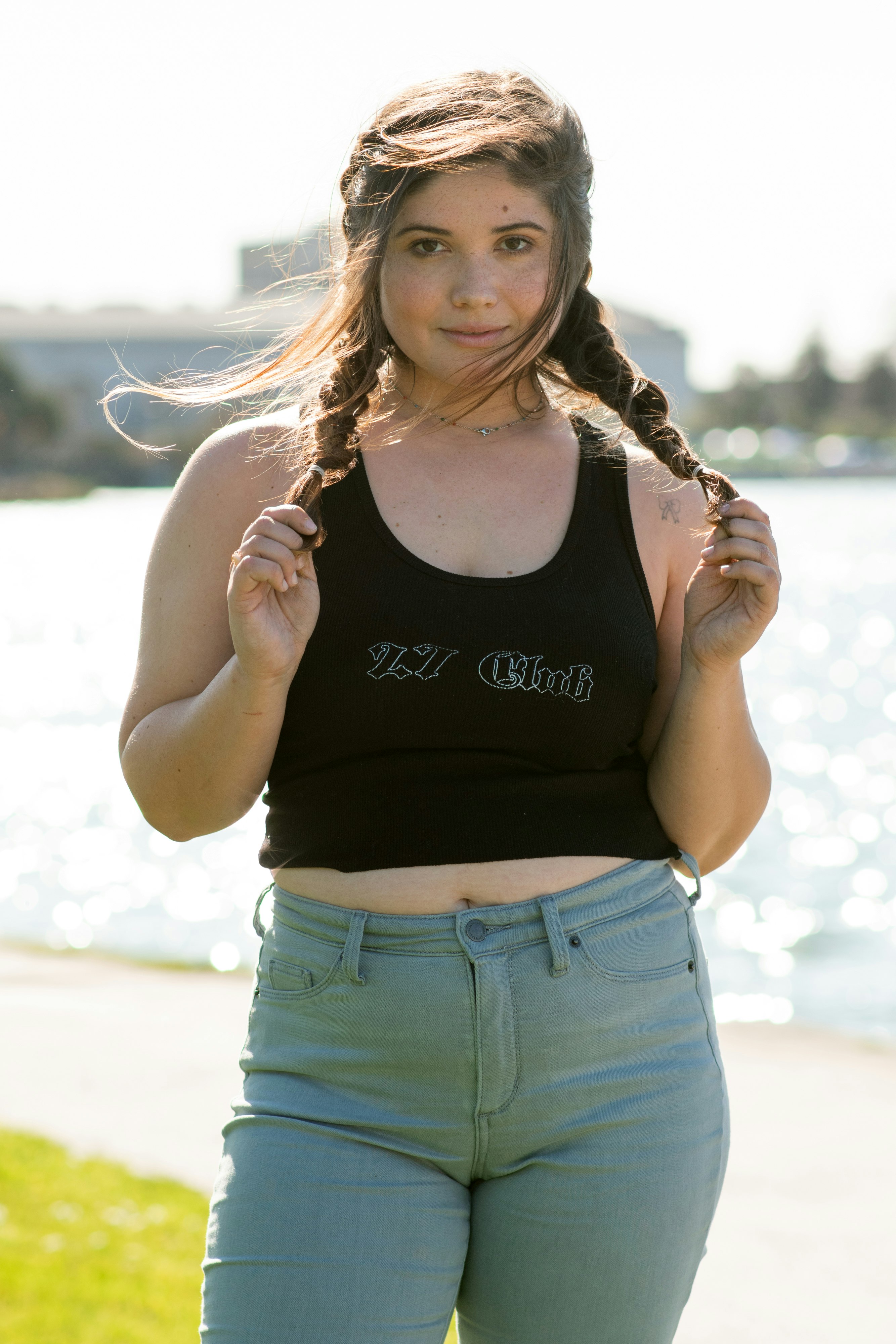 woman in black tank top and blue denim shorts